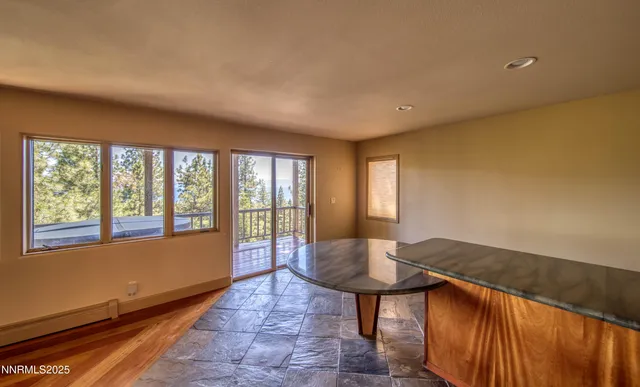 a lobby with furniture and a floor to ceiling window