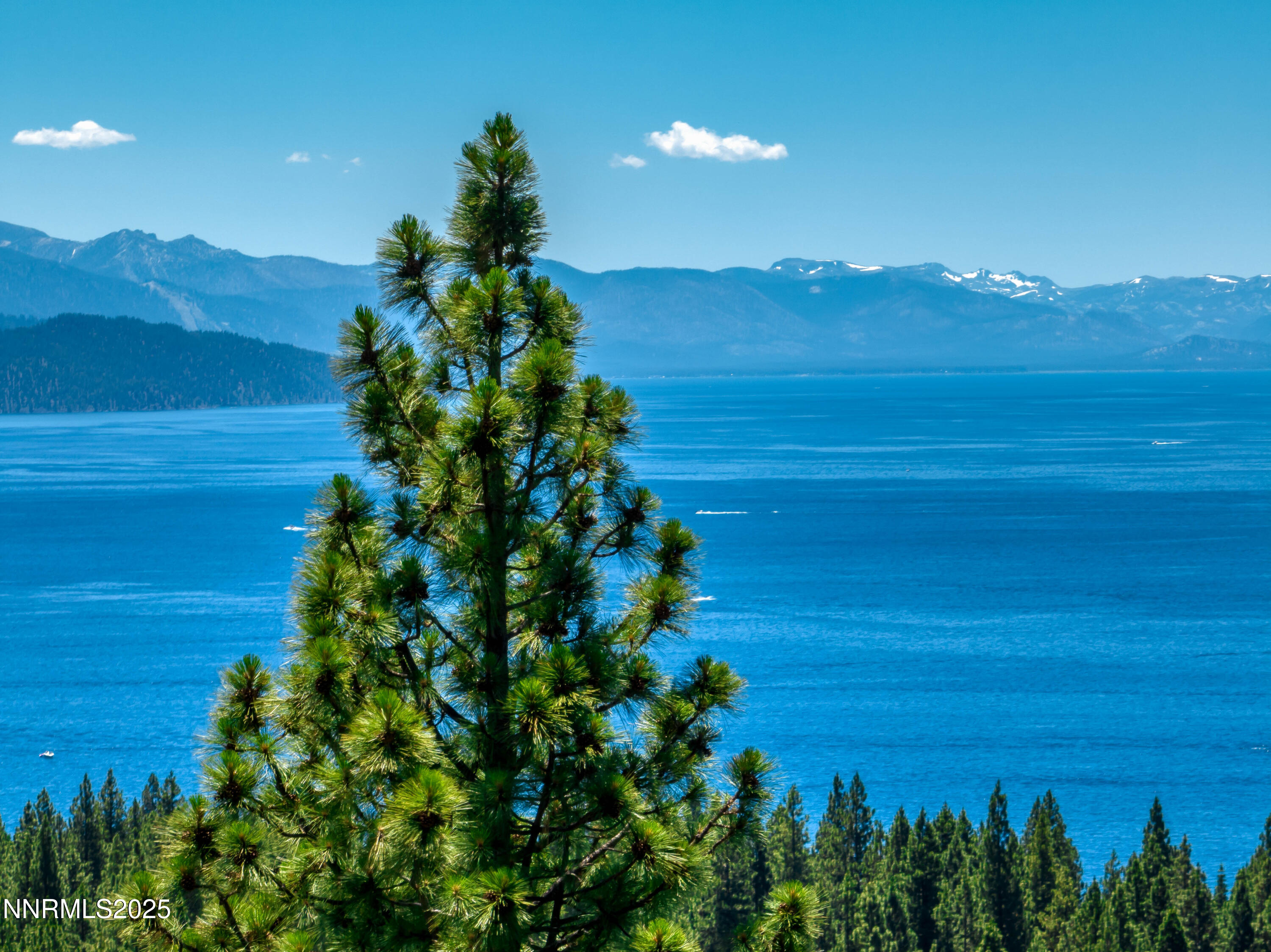 689 Tyner Way Incline Village, NV 89451 - Photo 32 of 50 a view of a lake with a mountain in the background