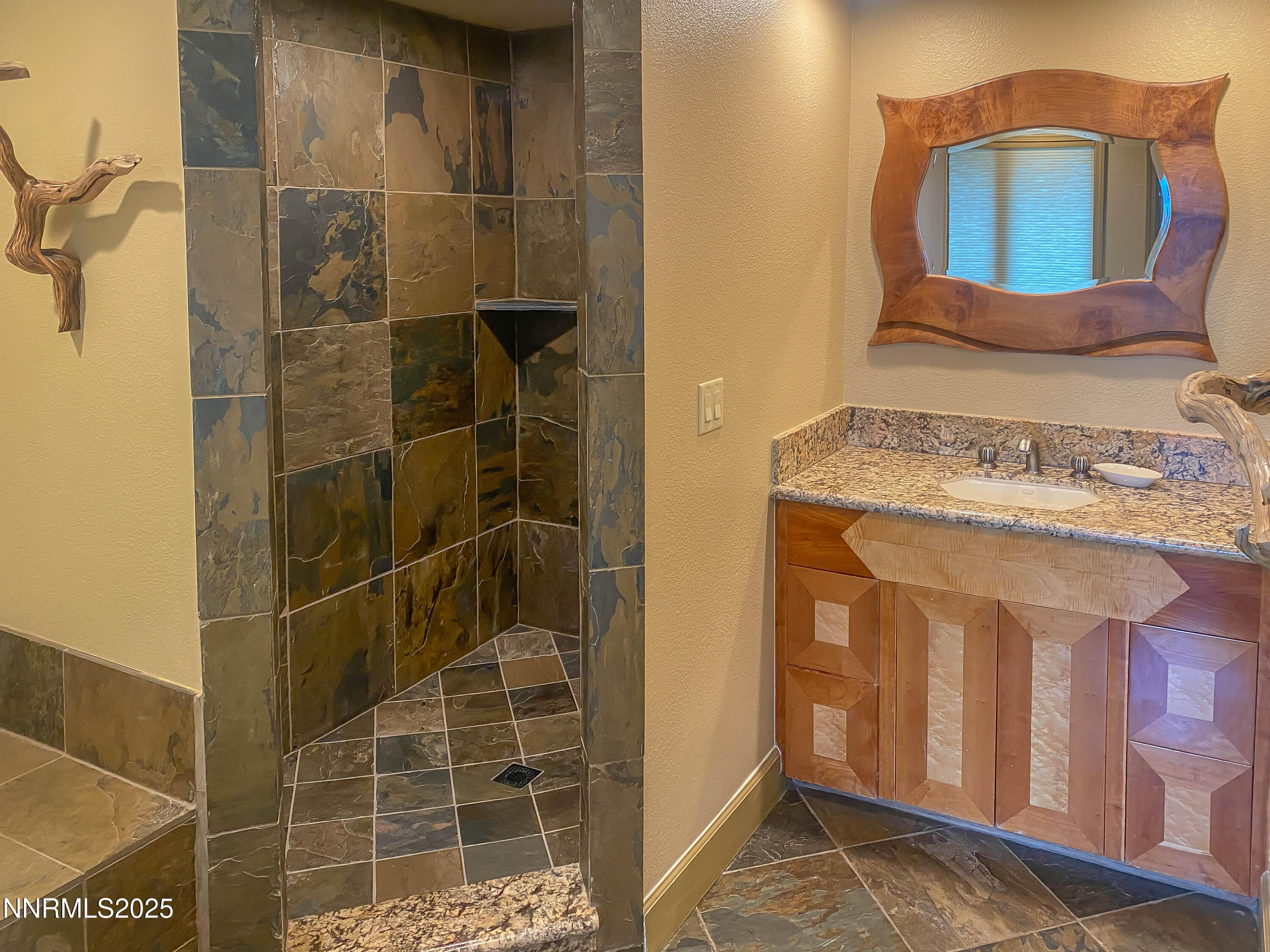 689 Tyner Way Incline Village, NV 89451 - Photo 43 of 50 a bathroom with a granite countertop sink and a mirror
