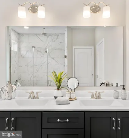 a bathroom with sinks and a mirror
