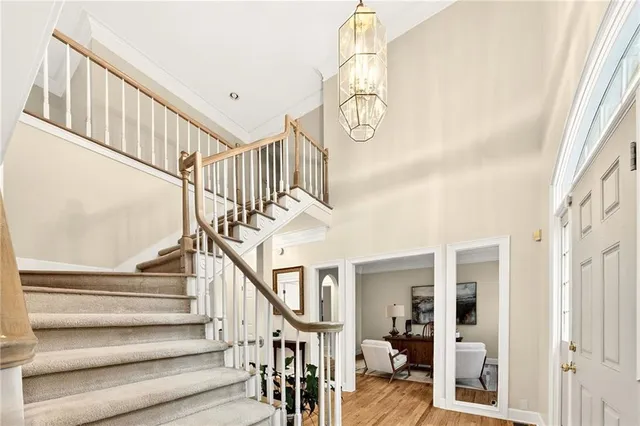 a bedroom with a bed and ceiling fan