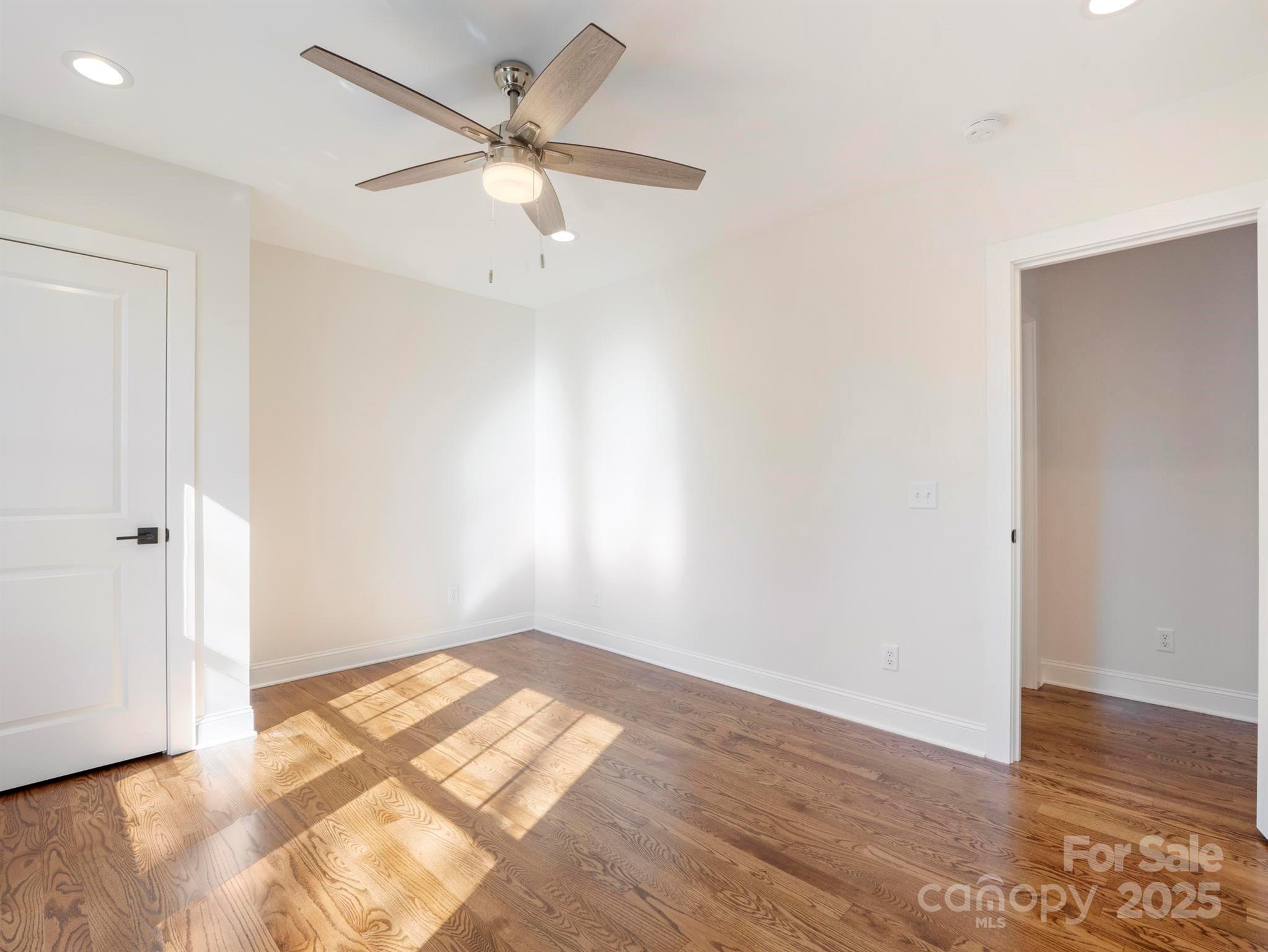 100 Gilbert Road Columbus, NC 28722 - Photo 17 of 24 an empty room with wooden floor and windows