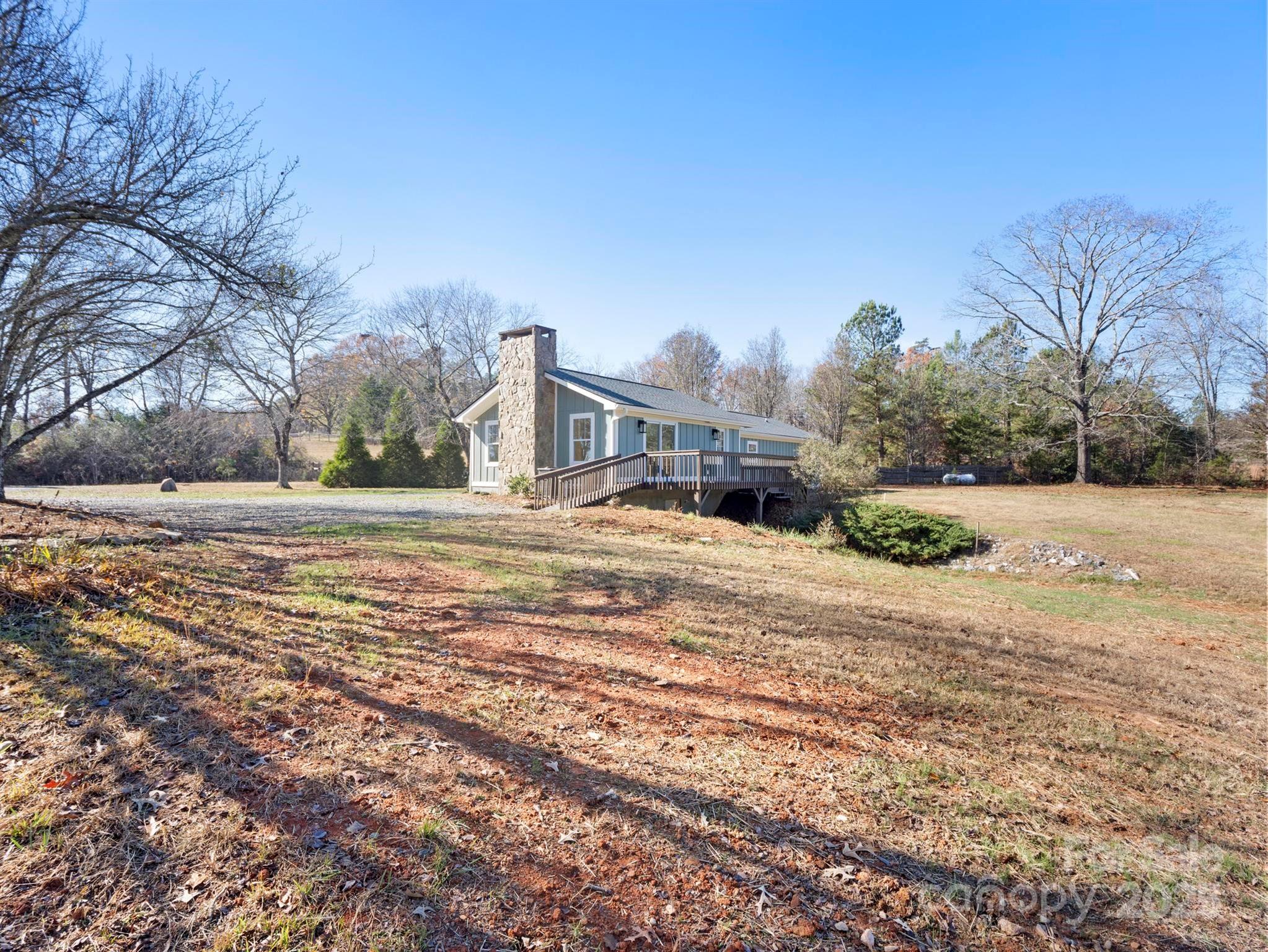 100 Gilbert Road Columbus, NC 28722 - Photo 2 of 24 a view of road with large trees