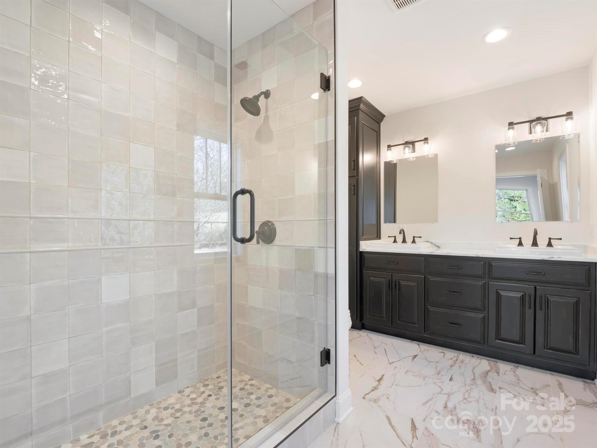 100 Gilbert Road Columbus, NC 28722 - Photo 22 of 24 a bathroom with a tub sink shower and mirror