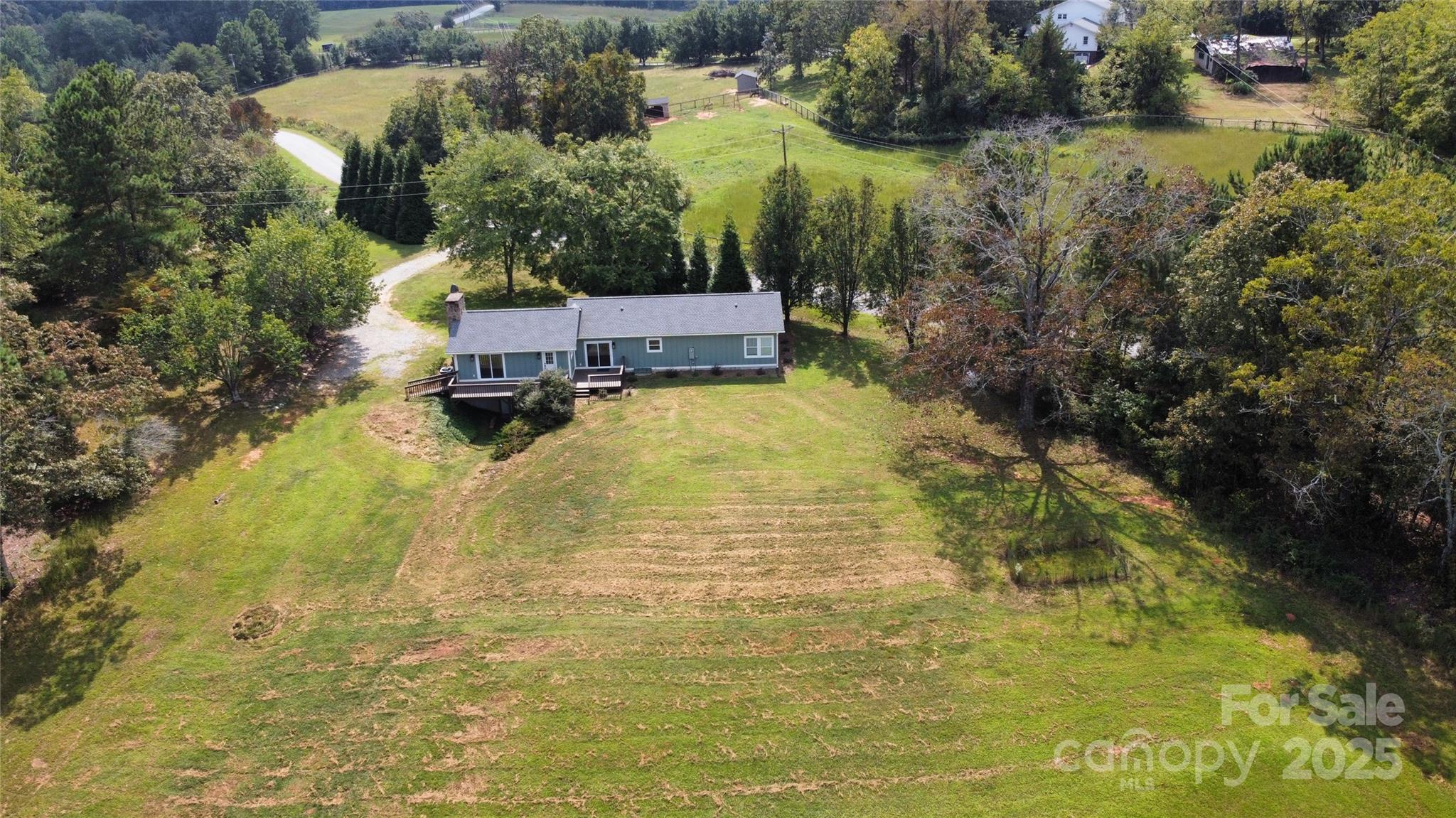 100 Gilbert Road Columbus, NC 28722 - Photo 3 of 24 an aerial view of residential houses with yard