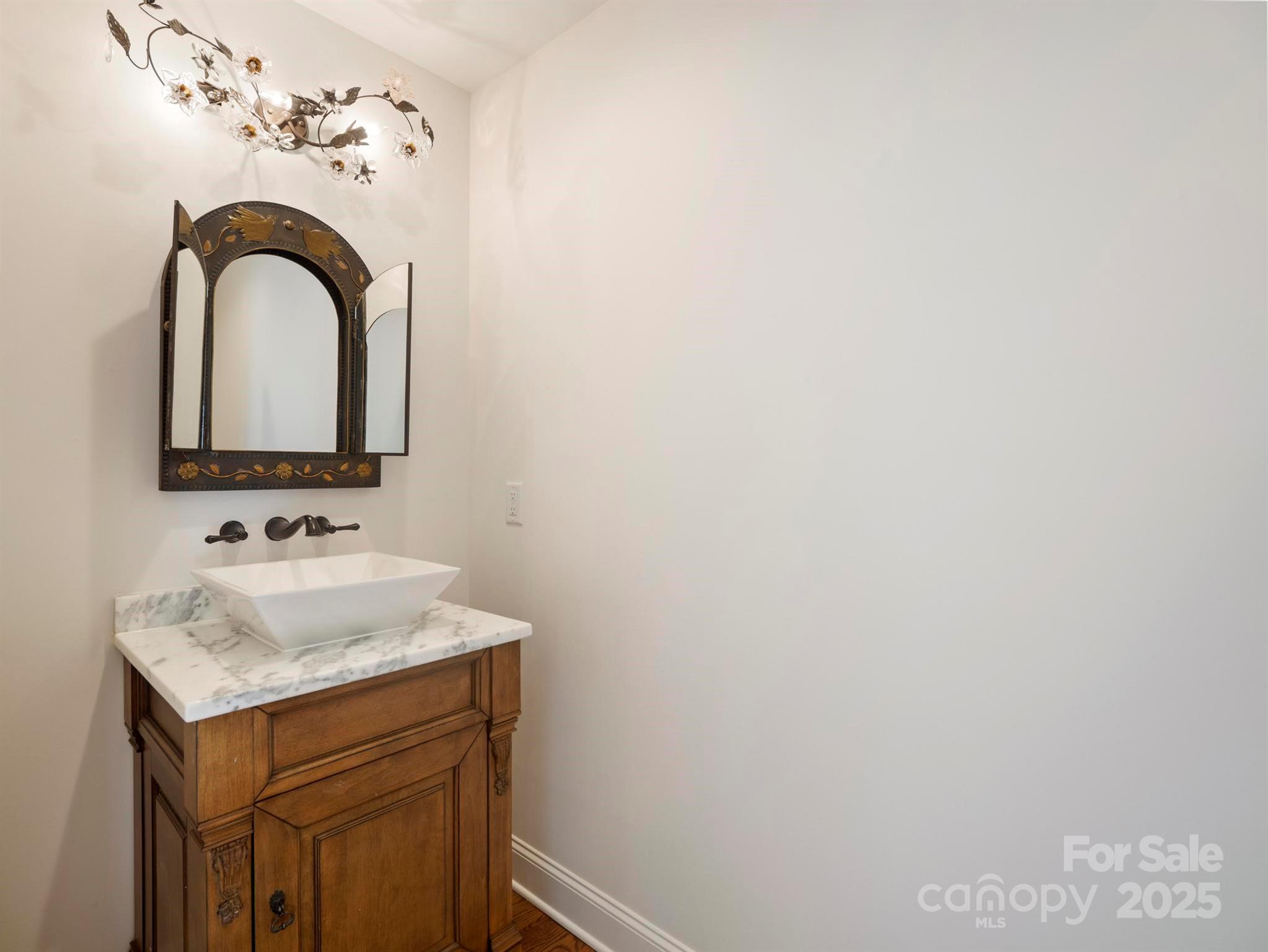 100 Gilbert Road Columbus, NC 28722 - Photo 8 of 24 a bathroom with a sink and a mirror