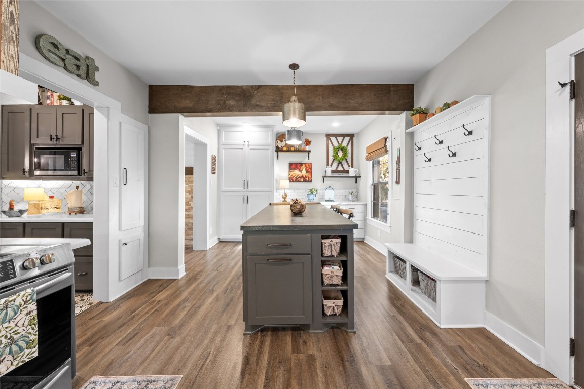 1005 East 14th Street Cameron, TX 76520 - Photo 14 of 40 a kitchen with stainless steel appliances a stove and a refrigerator