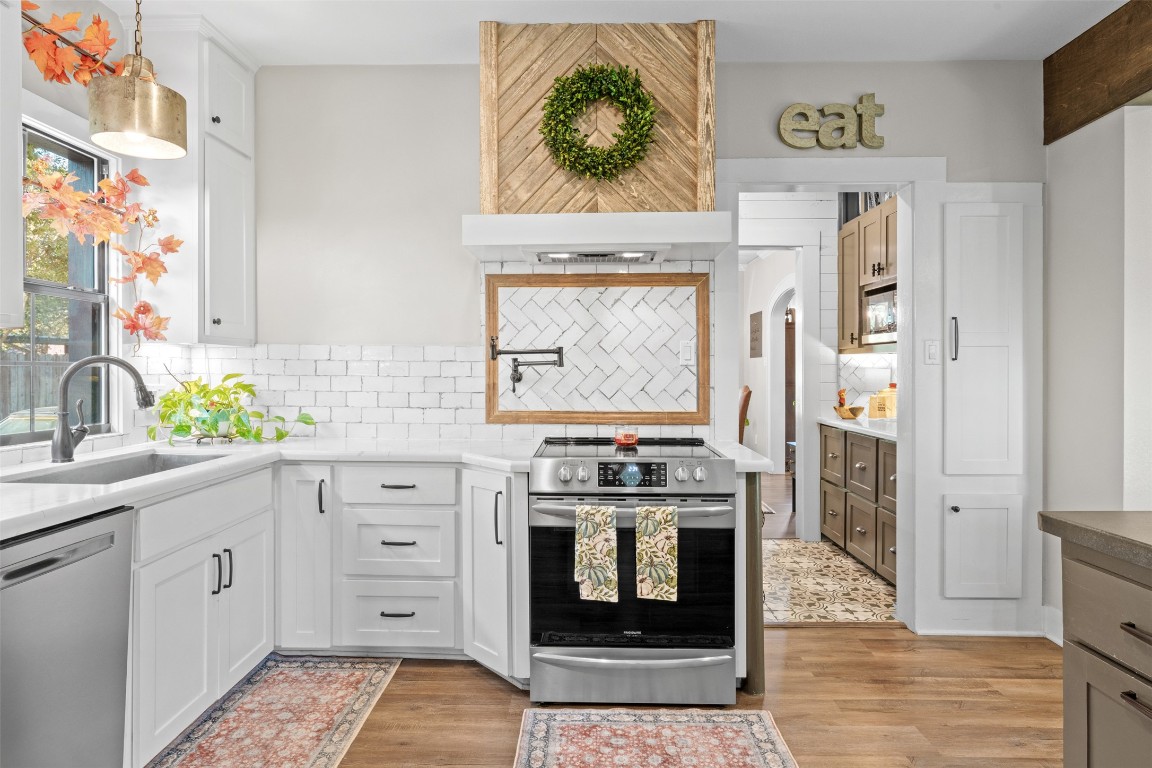1005 East 14th Street Cameron, TX 76520 - Photo 19 of 40 a kitchen with a stove oven and sink