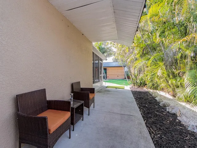 a living room with a window and a table