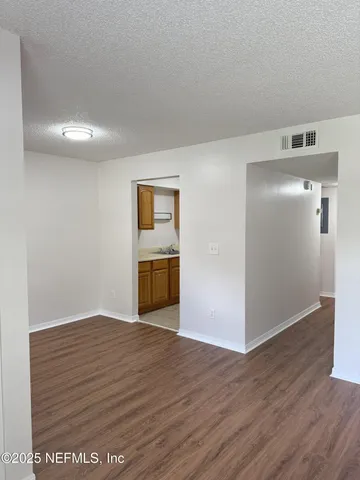 a view of a livingroom with wooden floor