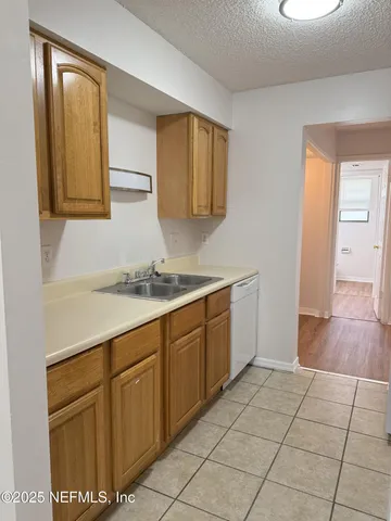 a spacious bathroom with a sink and a mirror