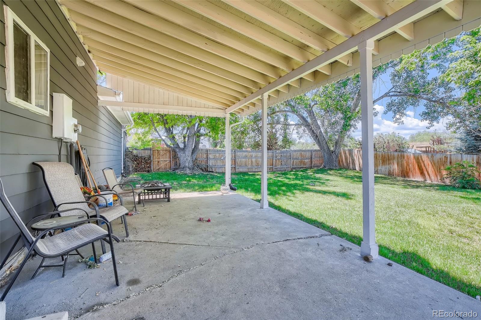 10541 Routt Street Westminster, CO 80021 - Photo 20 of 26 a view of yard with patio