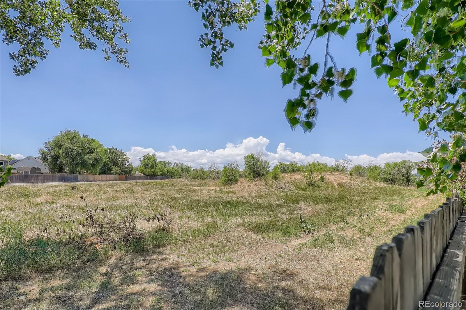 10541 Routt Street Westminster, CO 80021 - Photo 26 of 26 a view of a yard with an outdoor space