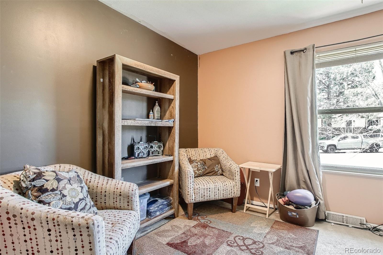 10541 Routt Street Westminster, CO 80021 - Photo 5 of 26 a living room with furniture and a window