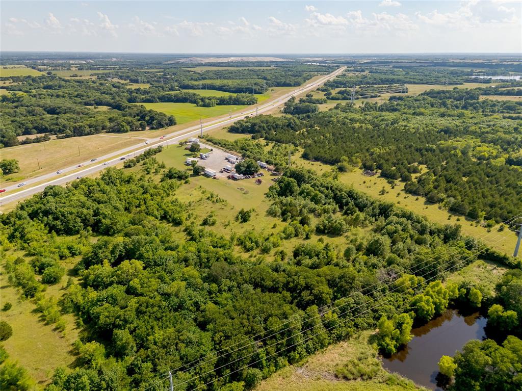 121 Sam Rayburn Highway Anna, TX 75409 - Photo 11 of 18 an aerial view of residential houses with outdoor space and ocean view