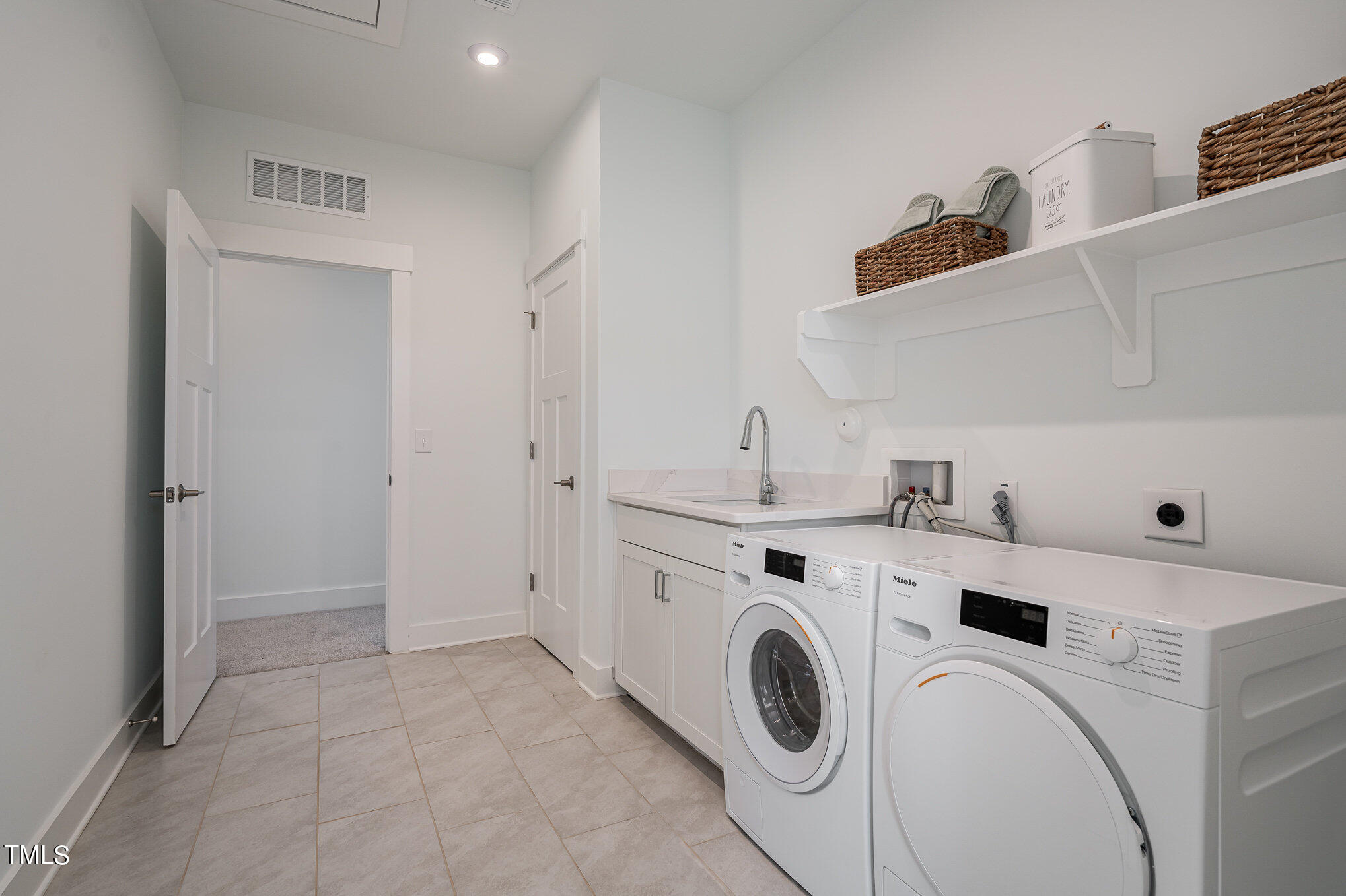 196 DUNLOE Loop Raleigh, NC 27603 - Photo 34 of 43 Double entry upstairs laundry room with sink