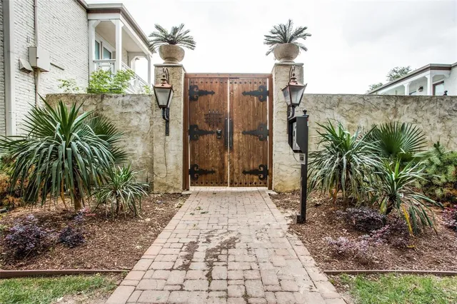 a couple of palm trees in front of a building