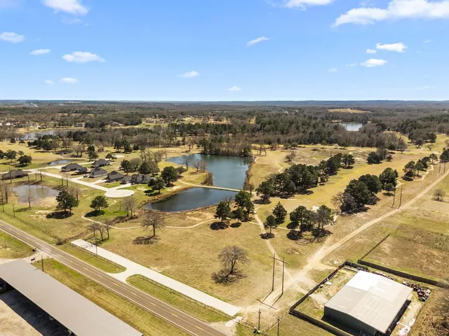 an aerial view of residential building and ocean view