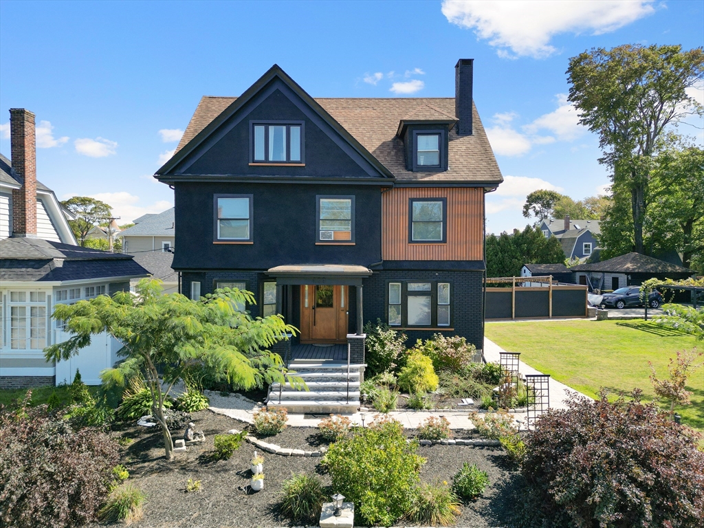 a front view of a house with garden