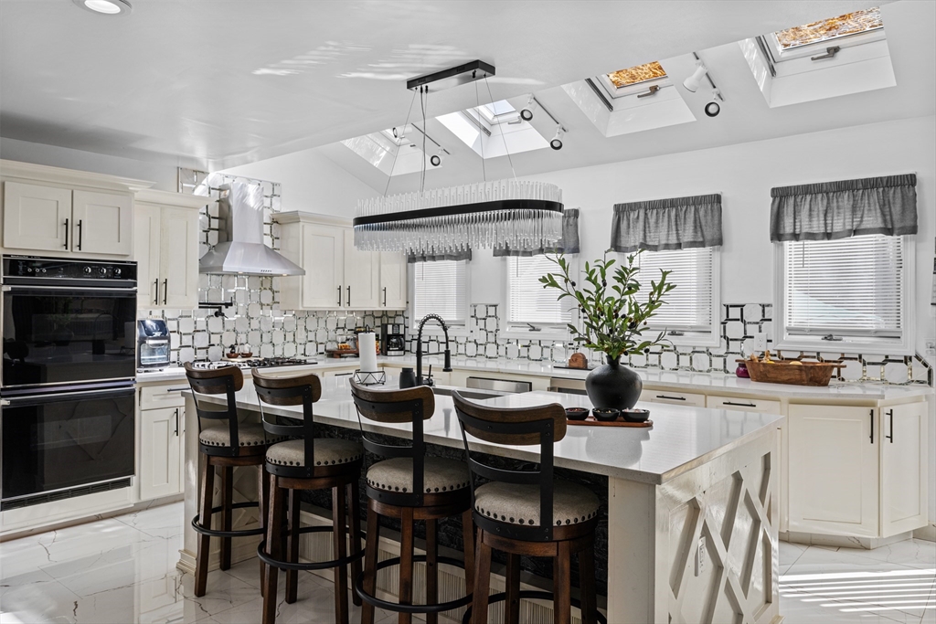 499 Madison Street Fall River, MA 02720 - Photo 12 of 38 a kitchen with a table and chairs in it