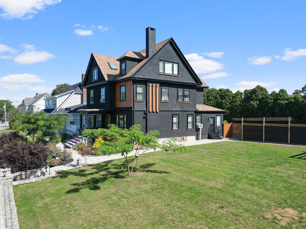 499 Madison Street Fall River, MA 02720 - Photo 2 of 38 a front view of a house with a yard