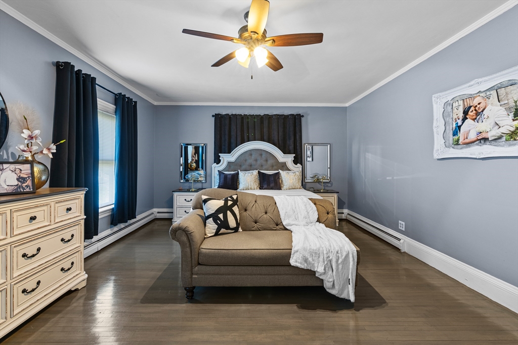 499 Madison Street Fall River, MA 02720 - Photo 25 of 38 a bedroom with a bed and a dresser