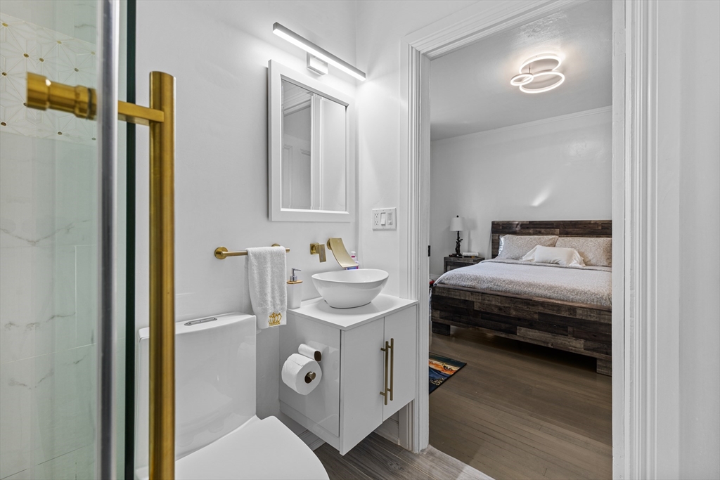 499 Madison Street Fall River, MA 02720 - Photo 26 of 38 a en suite bathroom with a sink and a mirror