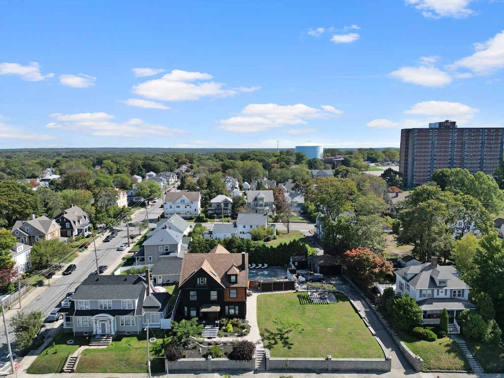 499 Madison Street Fall River, MA 02720 - Photo 3 of 38 an aerial view of a houses with a swimming pool