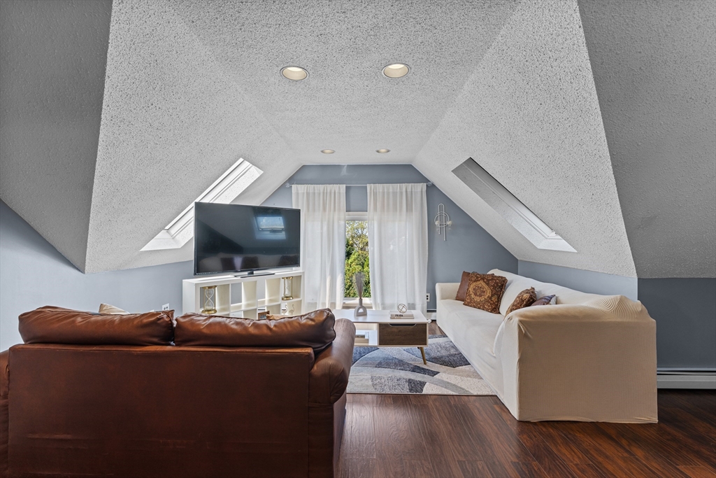 499 Madison Street Fall River, MA 02720 - Photo 31 of 38 a living room with furniture and a flat screen tv