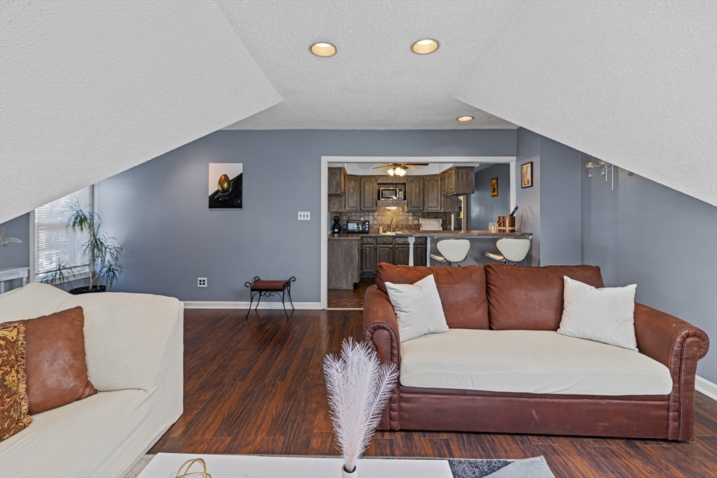 499 Madison Street Fall River, MA 02720 - Photo 32 of 38 a living room with furniture and a flat screen tv
