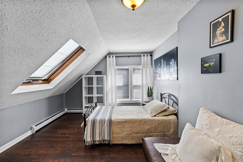 499 Madison Street Fall River, MA 02720 - Photo 36 of 38 a bedroom with furniture and a window