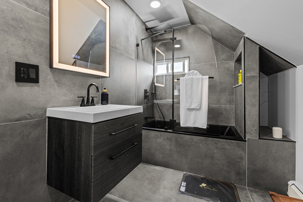 499 Madison Street Fall River, MA 02720 - Photo 38 of 38 a bathroom with a sink a mirror and a shower