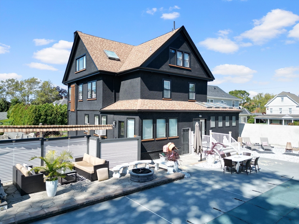 499 Madison Street Fall River, MA 02720 - Photo 4 of 38 a front view of a house with patio