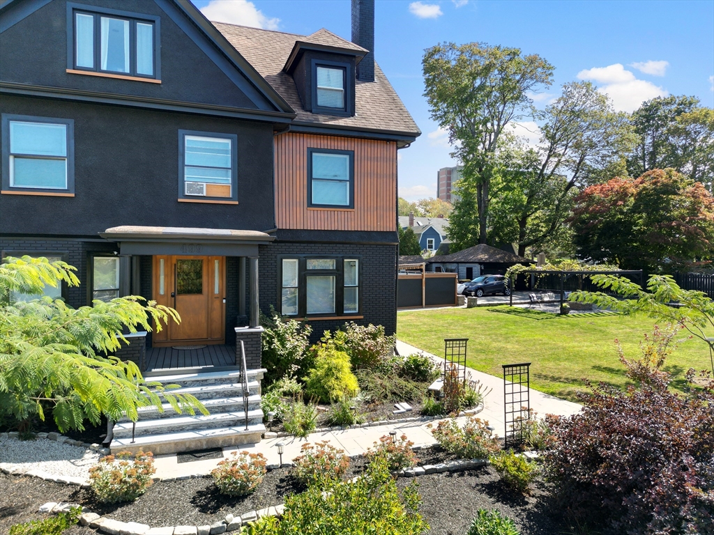 499 Madison Street Fall River, MA 02720 - Photo 5 of 38 a front view of a house with a yard