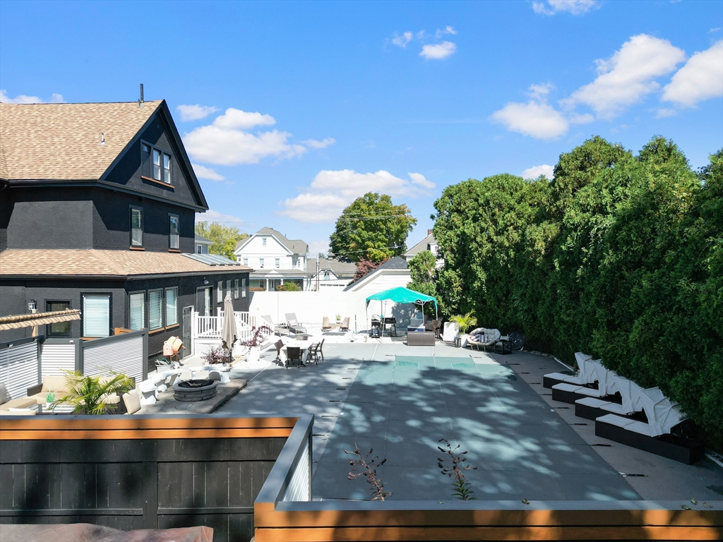 499 Madison Street Fall River, MA 02720 - Photo 6 of 38 a view of a house with backyard porch and sitting area