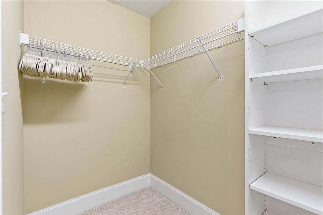 204 Butler Avenue Greenville, SC 29601 - Photo 24 of 26 Functional closet offers ample storage with wire shelving and a built-in bookcase for organization.
