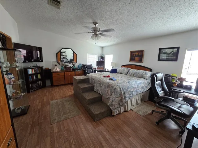 a spacious bathroom with a double vanity sink and a mirror