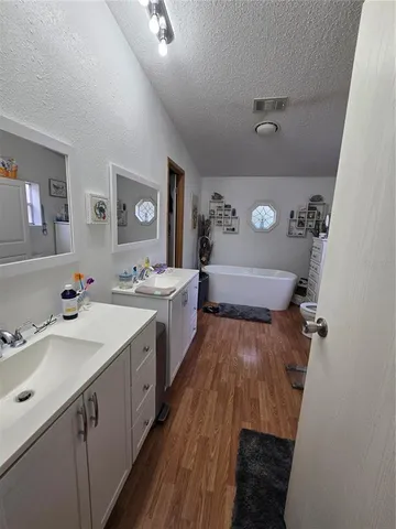 a bathroom with a sink a mirror and a toilet