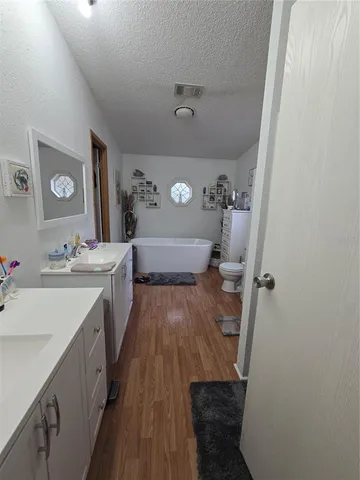 a view of bathroom with dual sinks