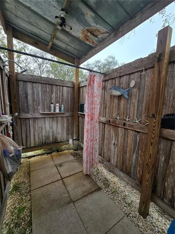 a view of house with backyard and seating area