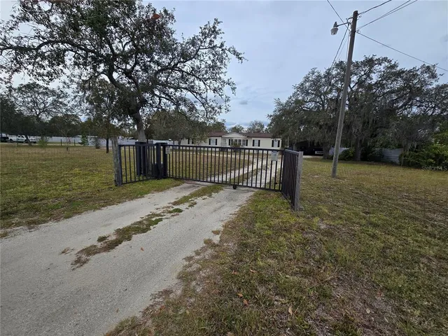 a view of backyard with green space