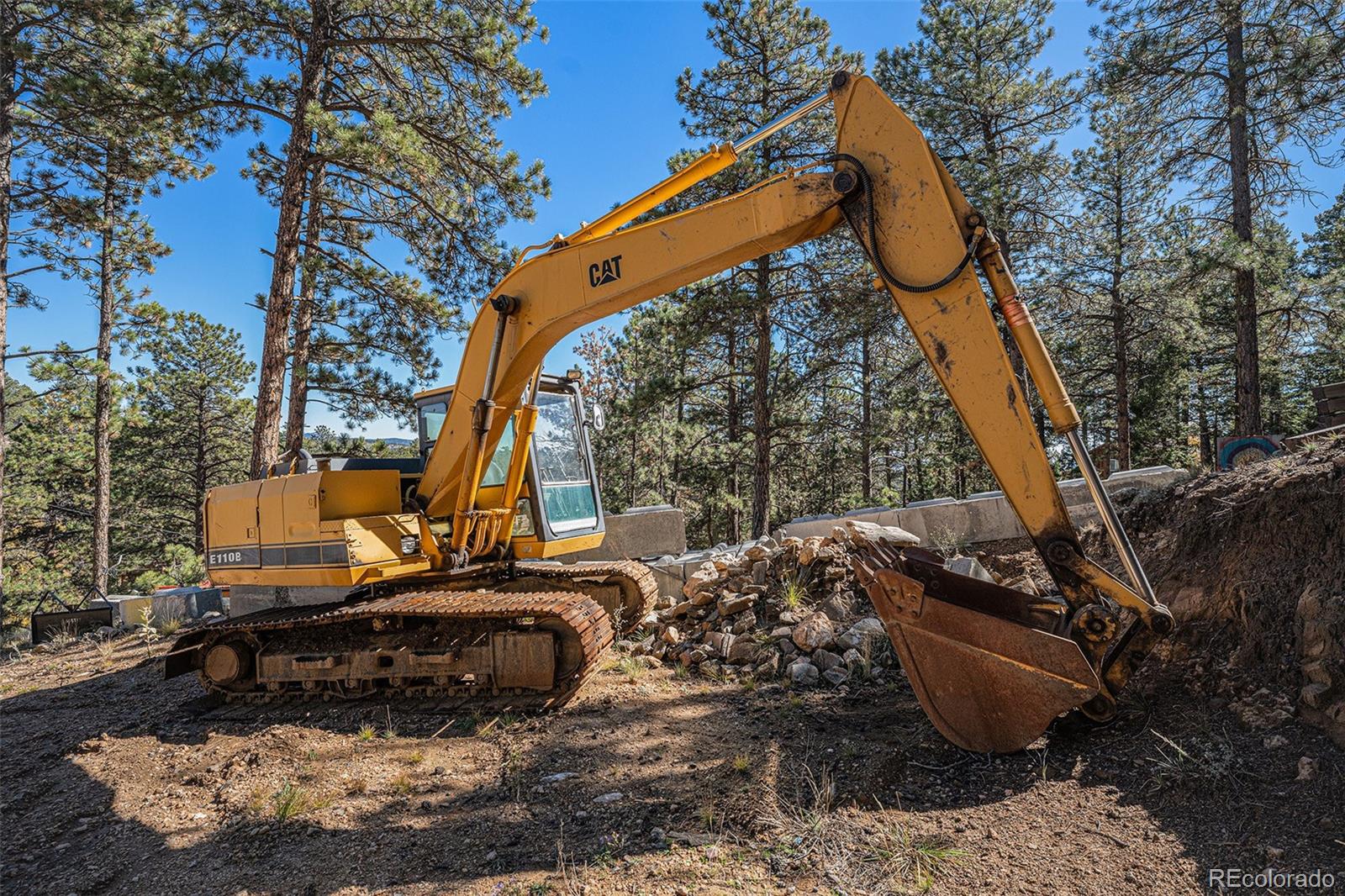 12 High View Lane Bailey, CO 80421 - Photo 18 of 23 a view of a couches and dinning table and chair in the patio
