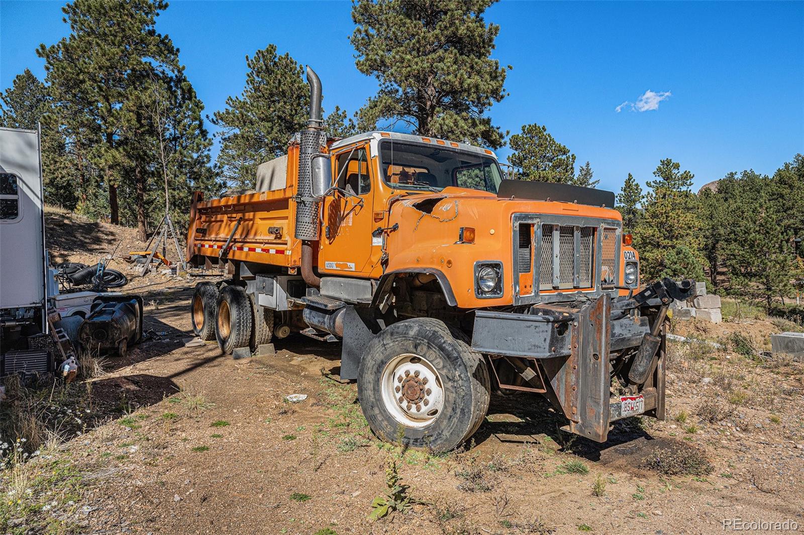 12 High View Lane Bailey, CO 80421 - Photo 19 of 23 a backyard of a house with table and chairs