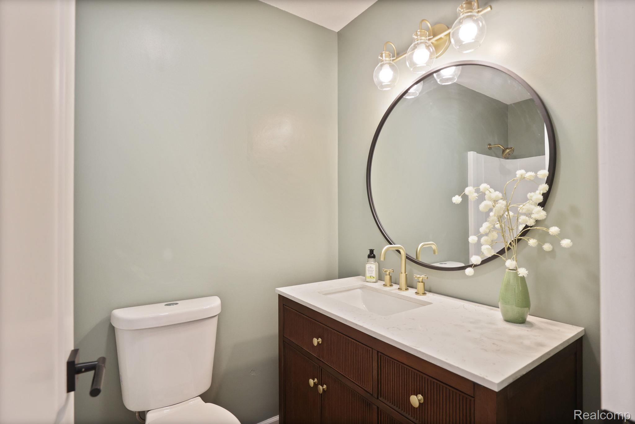 3937 Curtis Road Birch Run, MI 48415 - Photo 22 of 33 Half bath with vanity and toilet