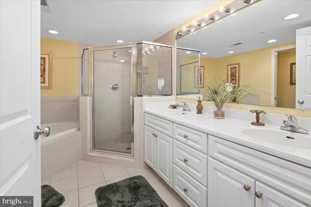 a white bath tub sitting next to a white toilet