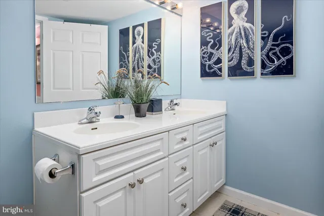 a bathroom with a toilet and a shower curtain