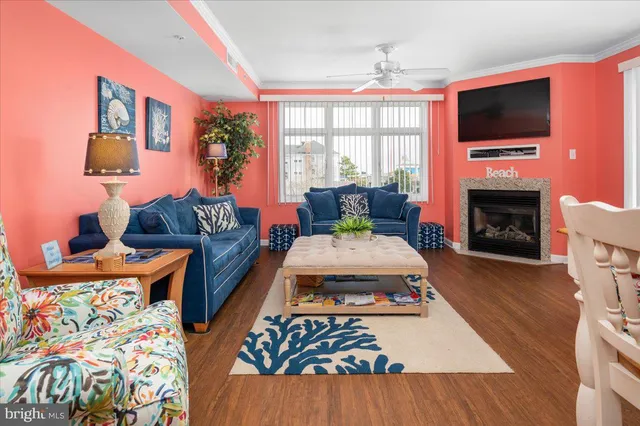a living room with furniture fireplace and flat screen tv