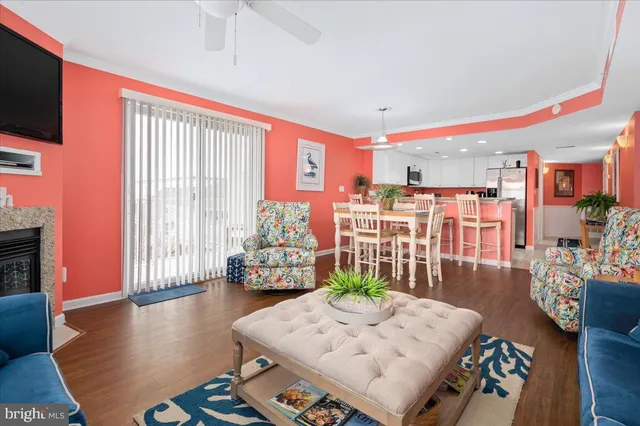 a kitchen with granite countertop a sink stove and refrigerator