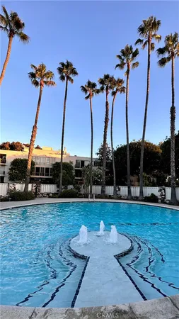 a view of a swimming pool with a yard