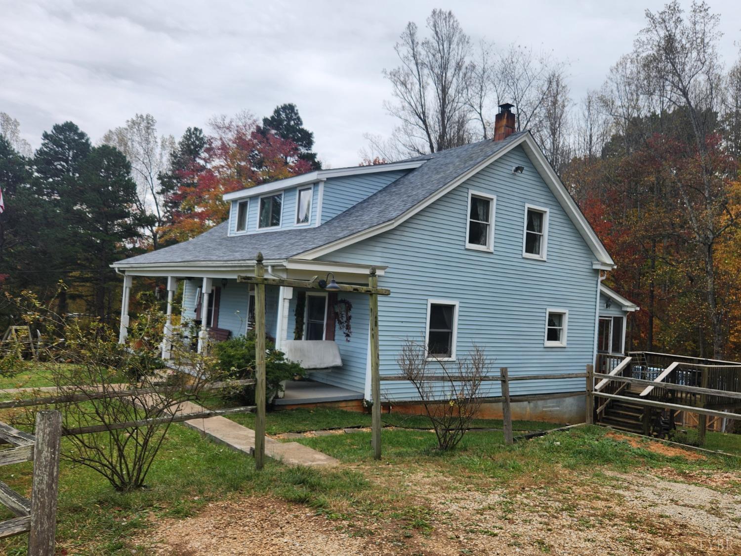 159 Buck Hill Drive Amherst, VA 24521 - Photo 13 of 31 a view of a yard in front of a house with plants and large trees
